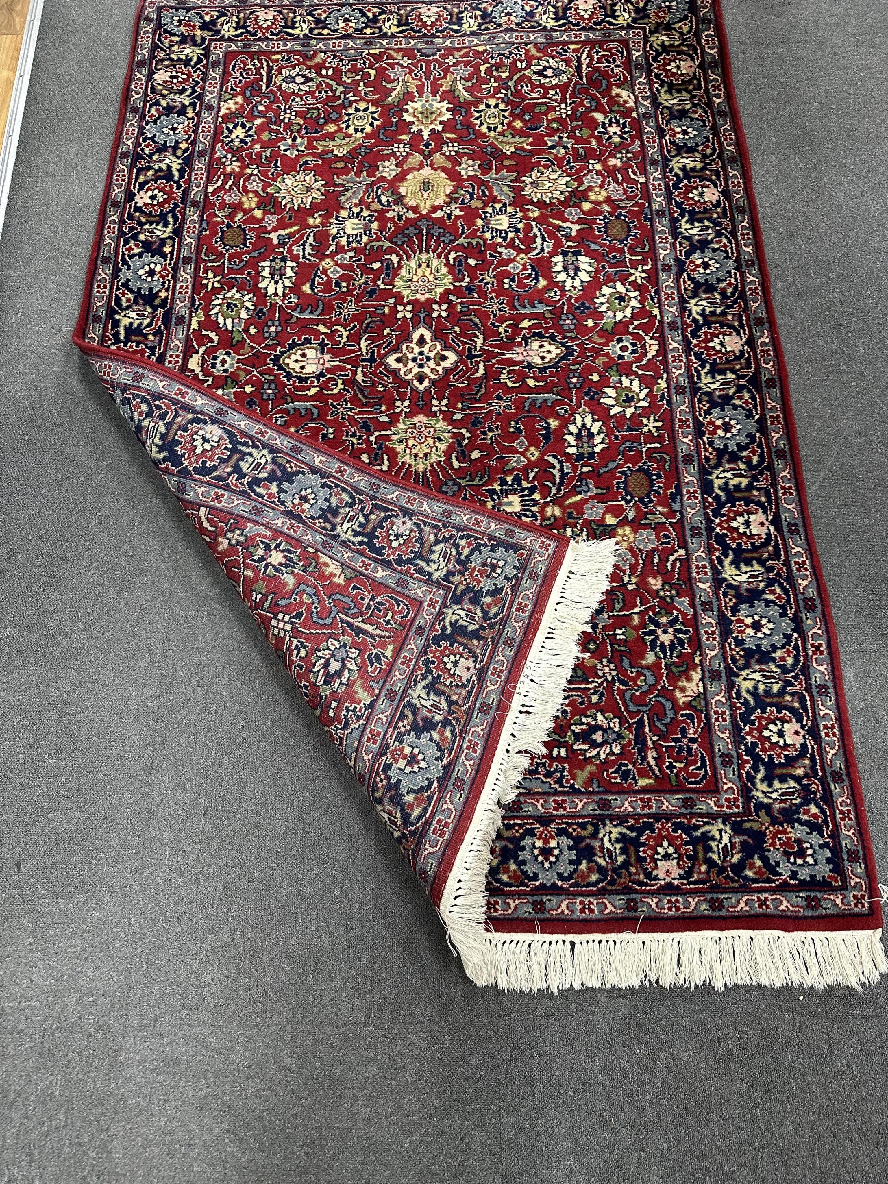 A North West Persian red ground rug, 190cm x 124cm. Condition - good.